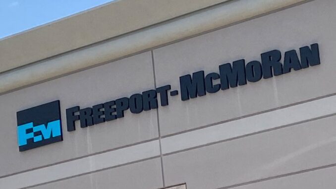 FILE PHOTO: The logo of copper miner Freeport-McMoRan Inc is displayed on their offices in Phoenix Freeport McMoRan